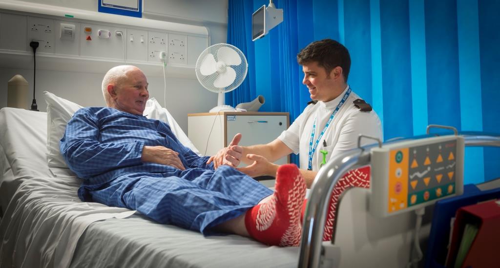 Above and Beyond_patient in hospital bed